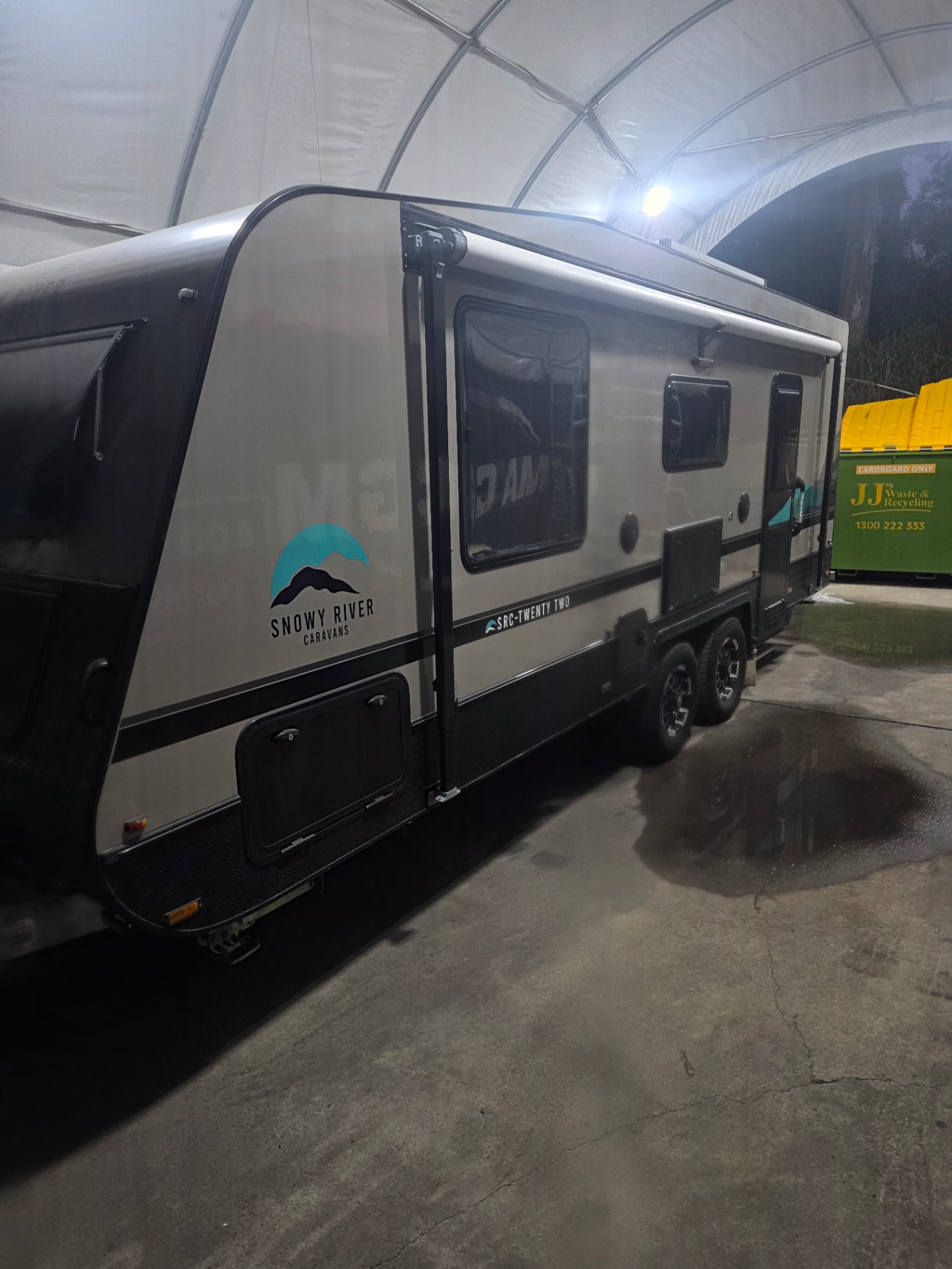 Large caravan covered in snow foam during an exterior paint restoration wash in Brisbane